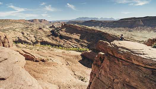 man sitting near the cliff thumbnail