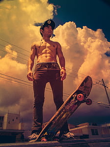 man in denim jeans with skateboard thumbnail
