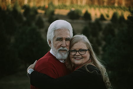 man and woman hugging outdoor during daytime thumbnail