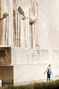 boy walking beside the statue thumbnail