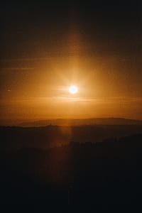 aerial photography of mountain range under golden hour thumbnail
