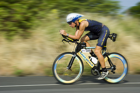 man wearing blue shorts riding bicycle thumbnail