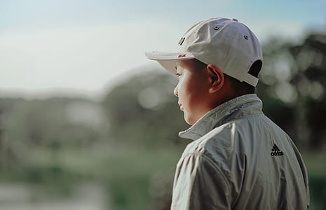 Boy Wearing Adidas Jacket and Gray Fitted Cap thumbnail