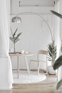 gray stainless steel lamp near white wooden table thumbnail