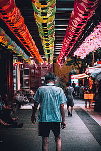 man standing near food stall thumbnail