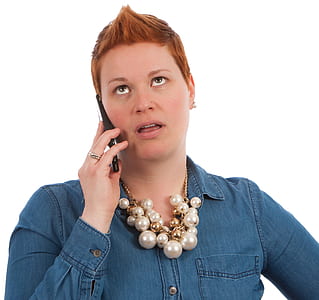 Fashion Photography of Woman Holding Smartphone in Blue Denim Dress Shirtr thumbnail