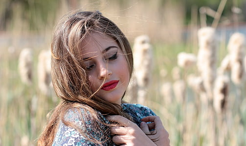 woman wearing green and white floral top during daytime thumbnail