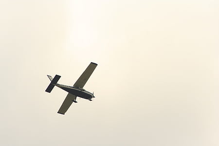 gray and white plane on air under white clouds during daytime thumbnail