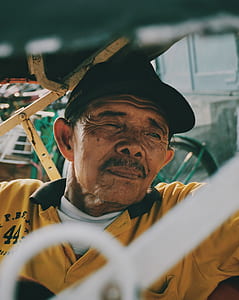 man wearing yellow and black collared top thumbnail