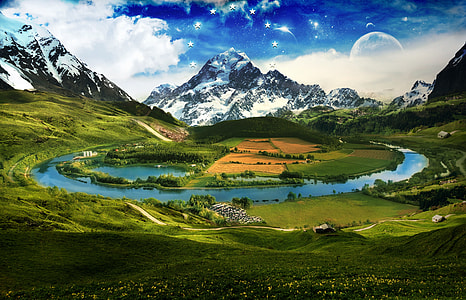 valley with body of water near snow capped mountain thumbnail