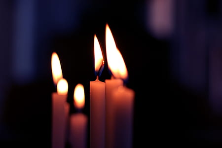 shallow focus photography of six white candles thumbnail
