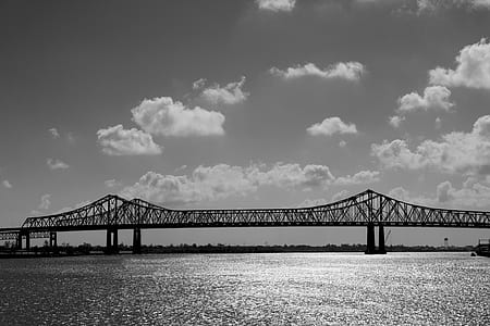 suspension bridge under cumulus clouds thumbnail