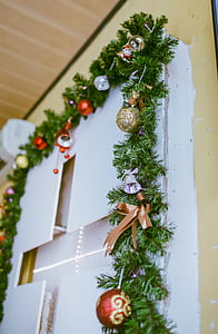 Photo of Green Garland With Bold Bauble Decor thumbnail