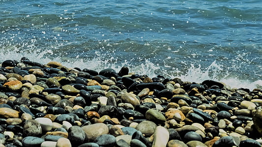 ocean waves crashing coastal stones thumbnail