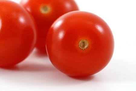 close-up photography of three tomatoes on white background thumbnail