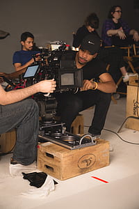 two men preparing professional camera thumbnail