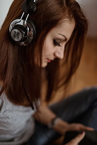 Beautiful young woman in headphones listening to music thumbnail