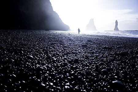 Silhouette Of A Person Standing Beside Seashore thumbnail