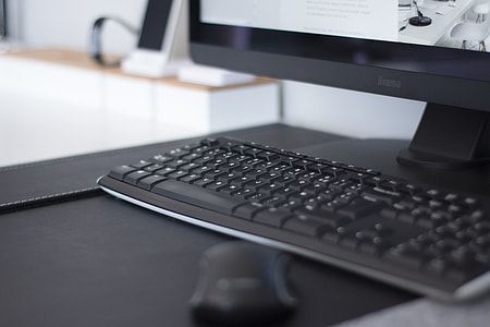 close photography of black computer keyboard beside flat screen monitor thumbnail