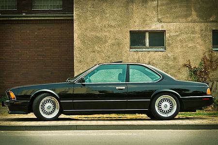 black BMW coupe parked on roadside during daytime thumbnail