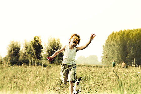 dog behind boy running thumbnail