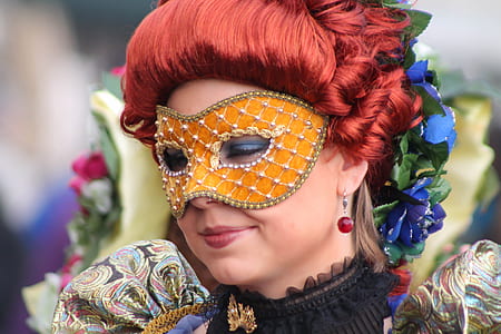 smiling woman wearing yellow floral masquerade mask thumbnail