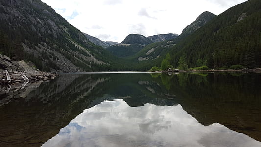 mountain surrounded with body of water thumbnail