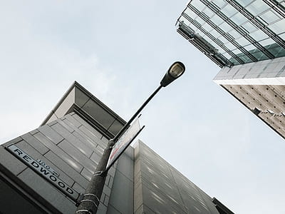 Redwood street signage beside concrete building thumbnail