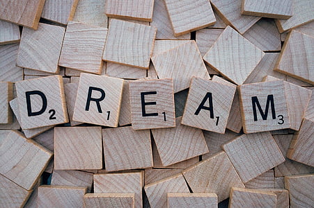 brown wooden scrabble blocks forming DREAM word thumbnail