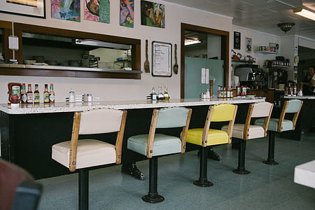 bar stools beside table thumbnail