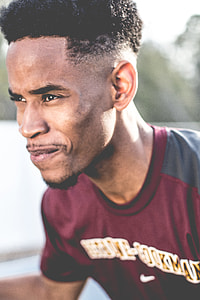 man wearing red Nike crew-neck shirt thumbnail