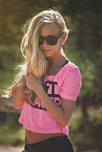 woman in pink shirt and black bottoms thumbnail