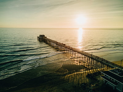 brown concrete dock during sunset thumbnail