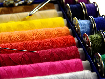 closeup photo of assorted-color of threads thumbnail