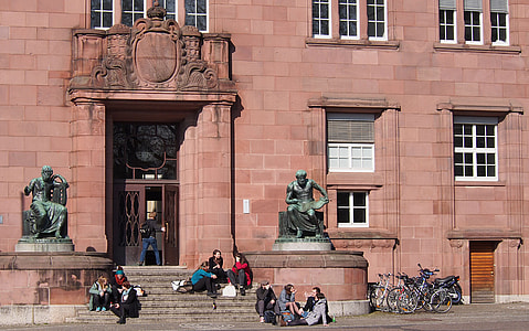 people sitting on concrete stairs during daytime thumbnail