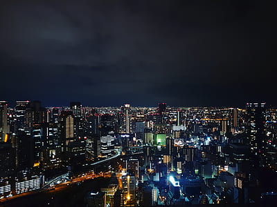 city skyline during under cloudy sky nighttime thumbnail