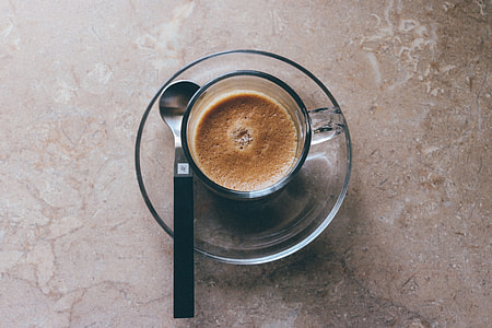 coffee on clear glass mug and saucer thumbnail