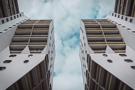 white and brown concrete buildings under blue sky thumbnail
