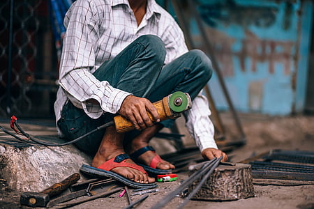 man holding angle grinder thumbnail