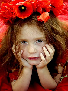 photo of a girl with red flowers thumbnail