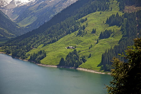 landscape photo of green grass covered mountain during daytime thumbnail