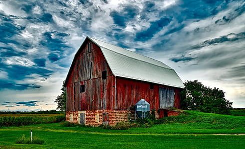 brown barn under cloudy skies thumbnail