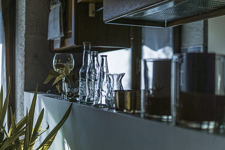 Assorted Clear Glass Bottles With Wine Glass in the Shelf thumbnail