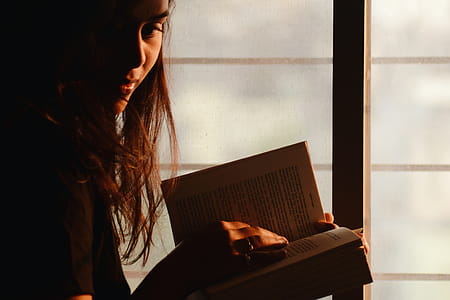 Close-Up Photography of a Woman Reading thumbnail