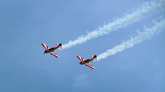 two red-and-white planes doing airshow thumbnail