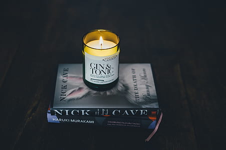 lighted candle on book thumbnail