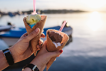 Man and Woman Holding Ice Creams thumbnail