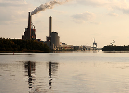 buildings beside body of water under white sky thumbnail