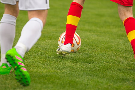 shallow focus photography of soccer players thumbnail