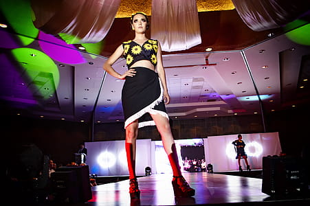 Woman Standing on Stage With Hands on Waist thumbnail